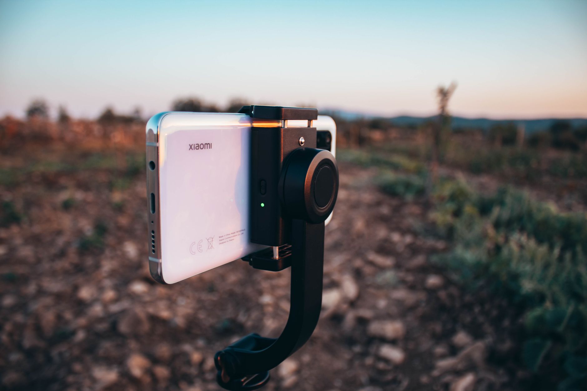Smartphone on gimbal capturing a scenic sunset in Bekilli, Turkey.