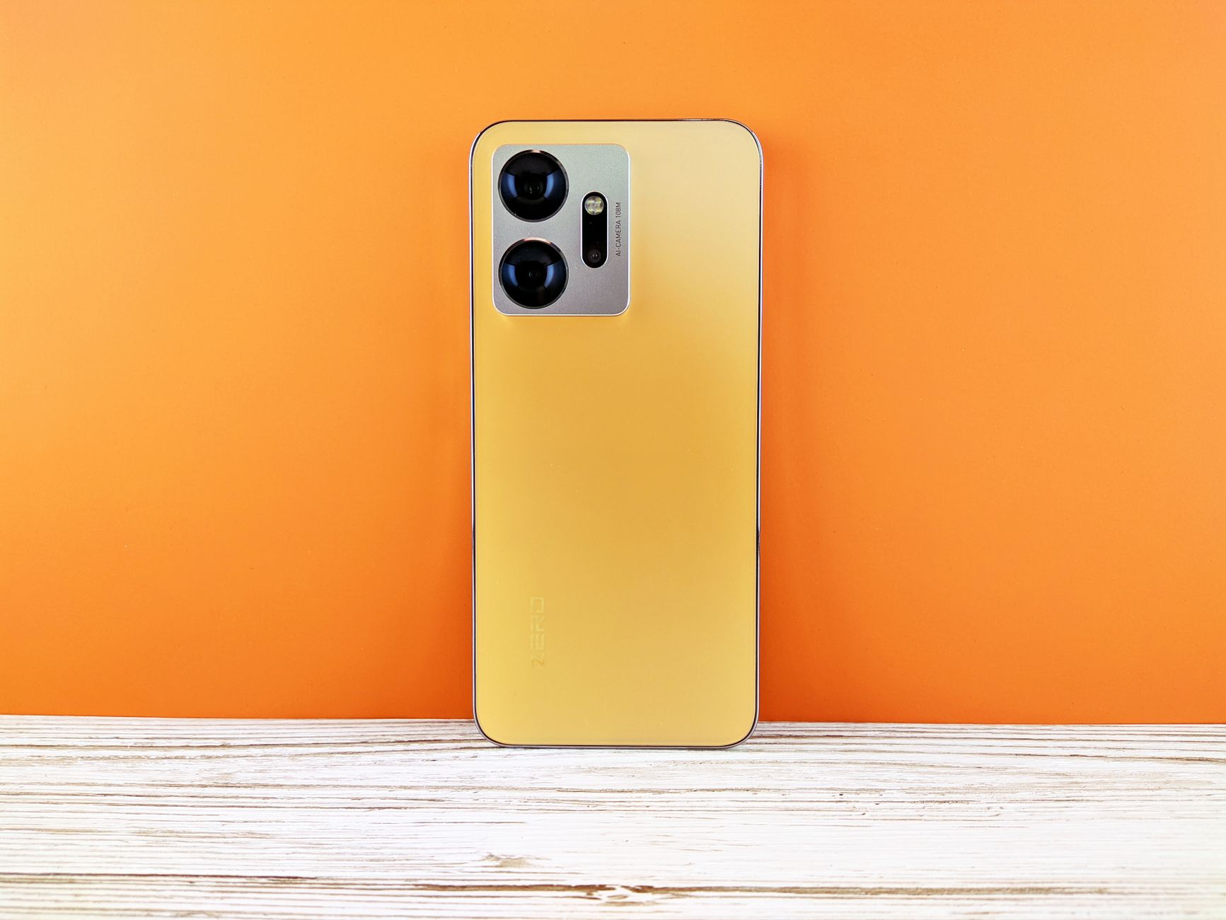 Stylish smartphone with dual cameras against a bright orange backdrop. Perfect for tech themes.