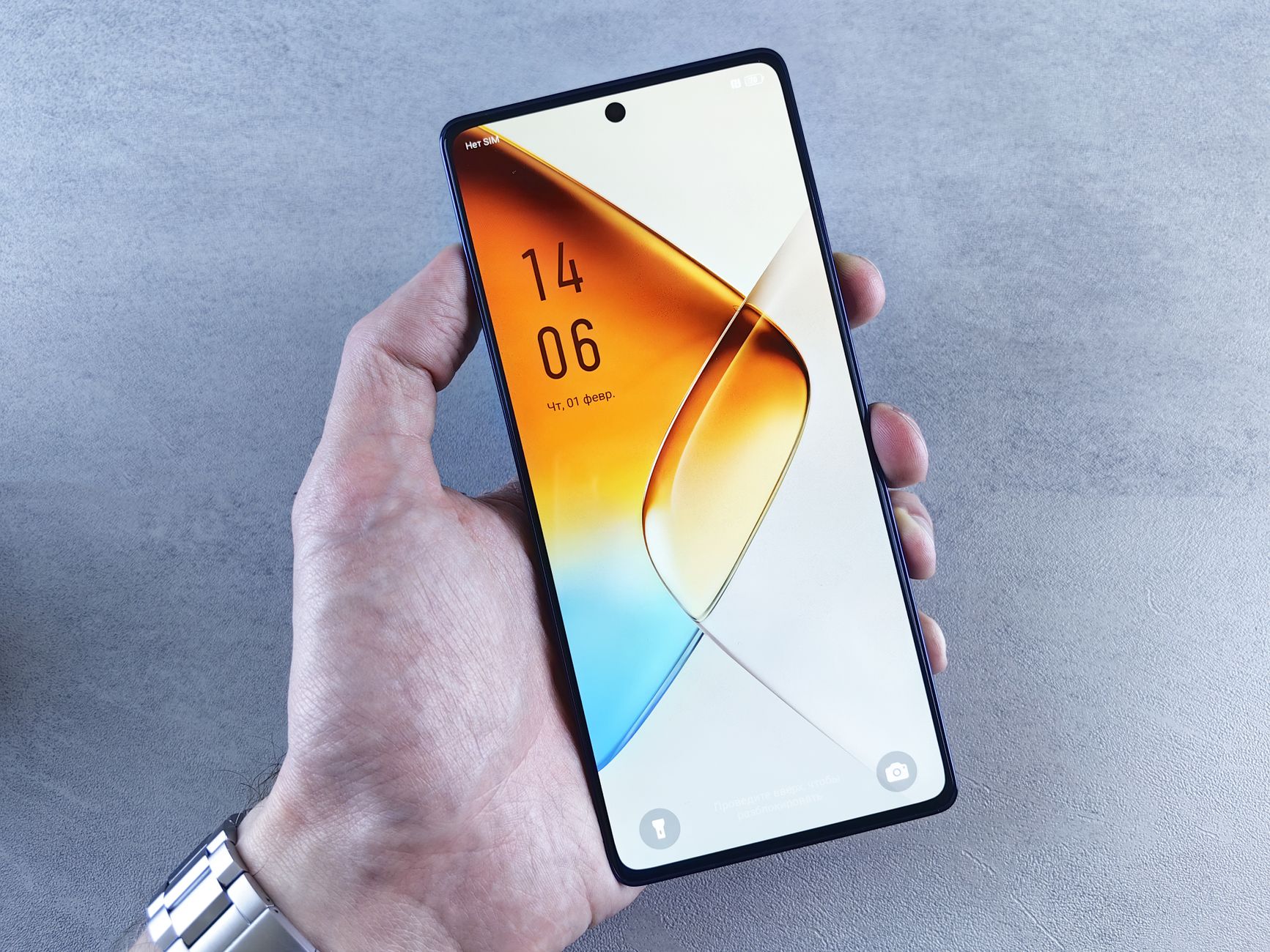 A close-up view of a hand holding a sleek smartphone with an orange-themed home screen, showcasing modern technology.