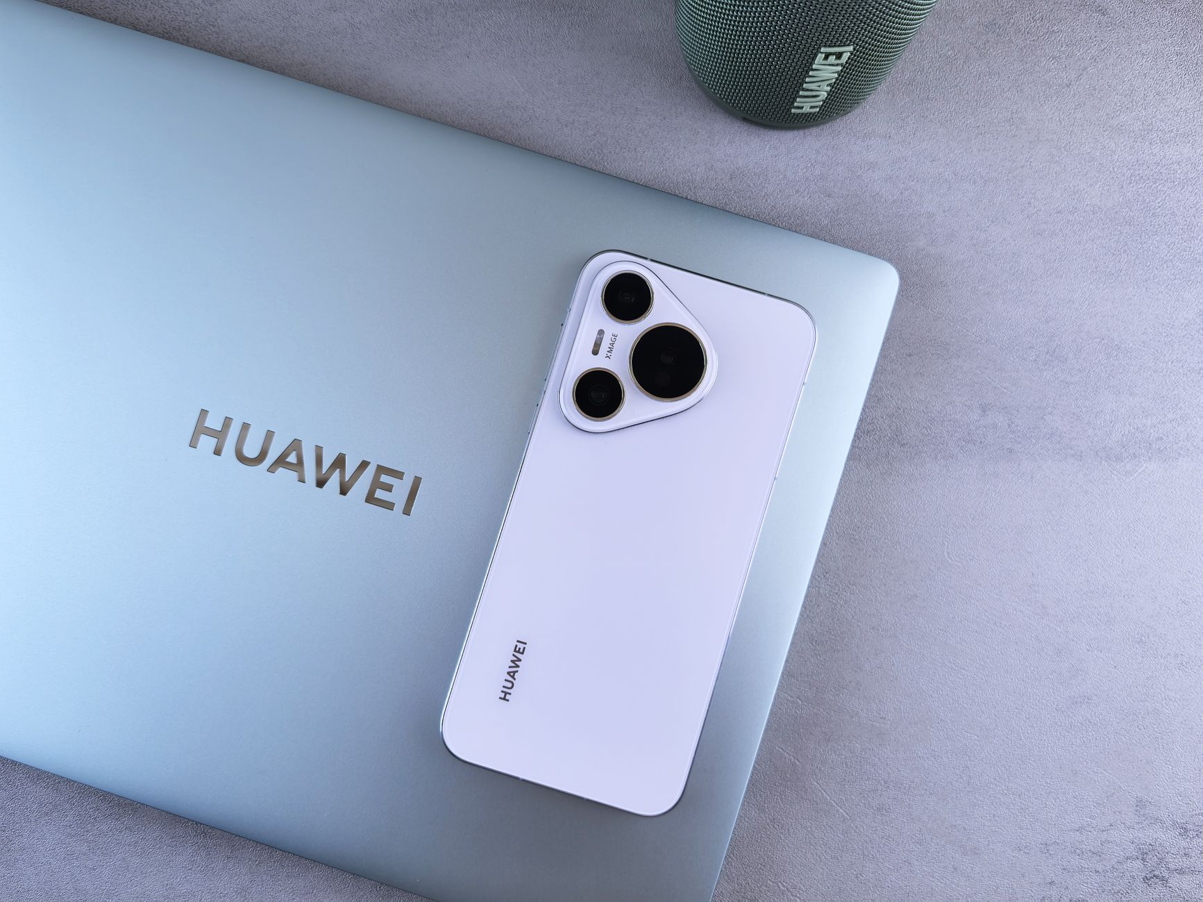 Flat lay of Huawei electronic devices showcasing sleek design and advanced technology.