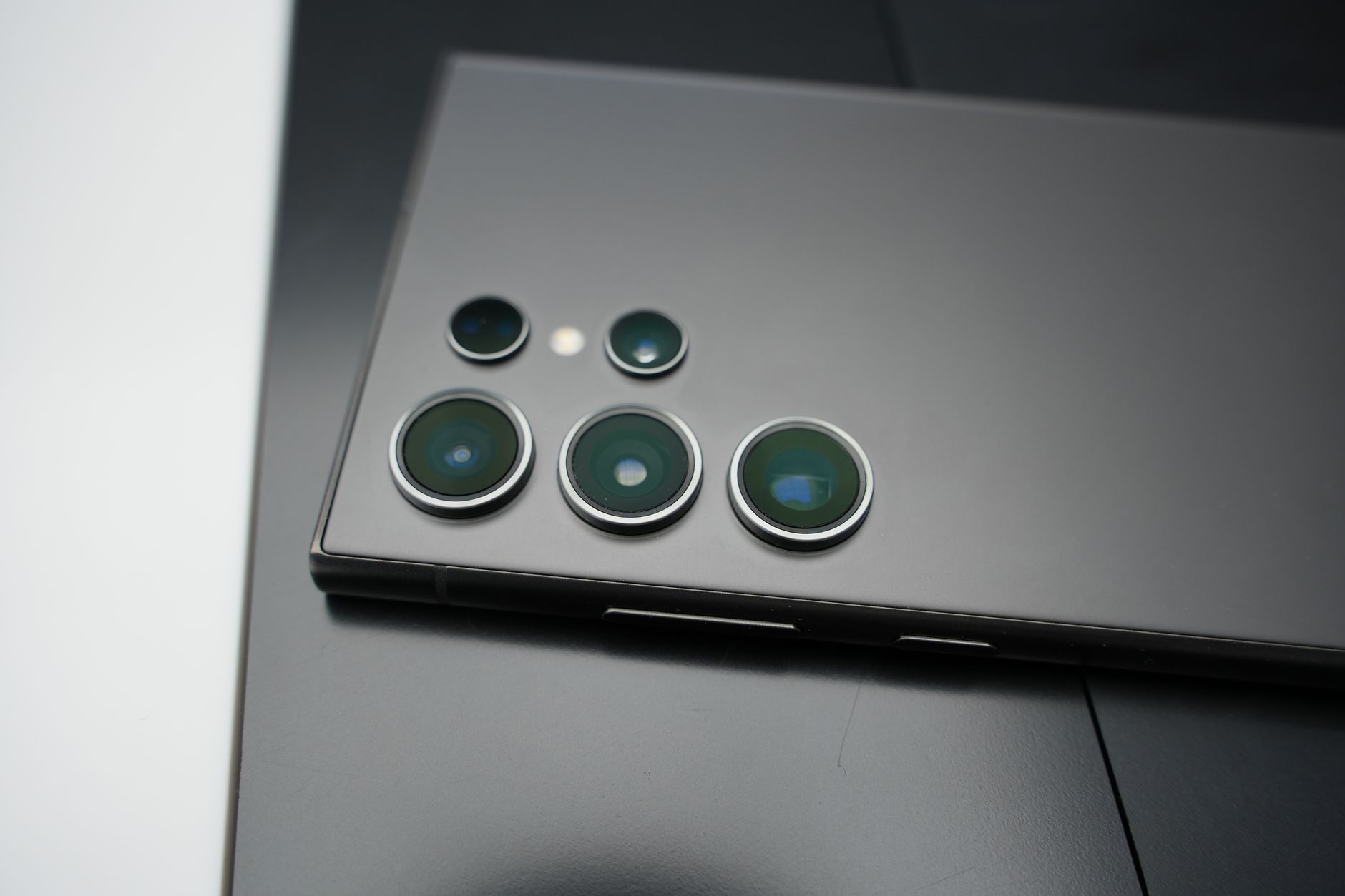 Detailed shot of a smartphone's camera lenses showcasing design and technology.